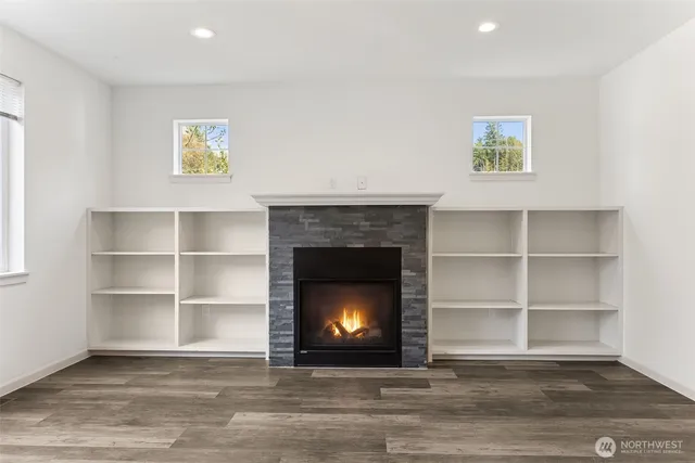 a living room with a fireplace and a fireplace