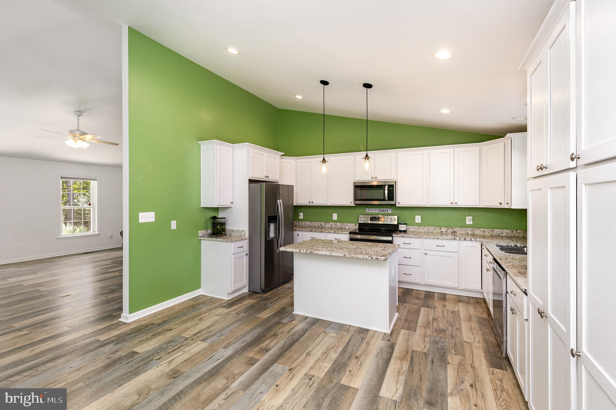 5428 Ridge Road Spotsylvania, VA 22551 - Photo 12 of 63 Modern kitchen with vibrant green accents.