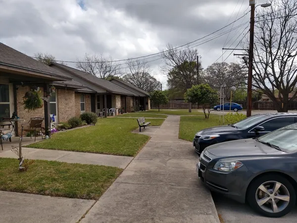 a view of a car parked in front of a house