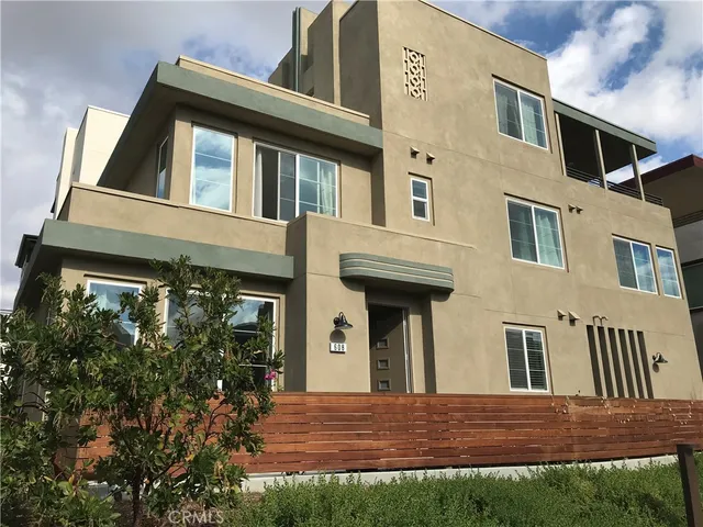 a view of a house with a small yard