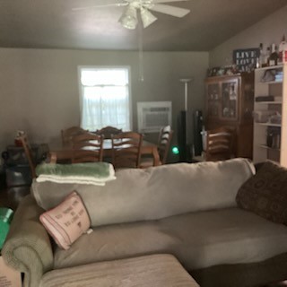 116 Grapeland Lake Road Grapeland, TX 75844 - Photo 8 of 18 a living room with furniture and a chandelier