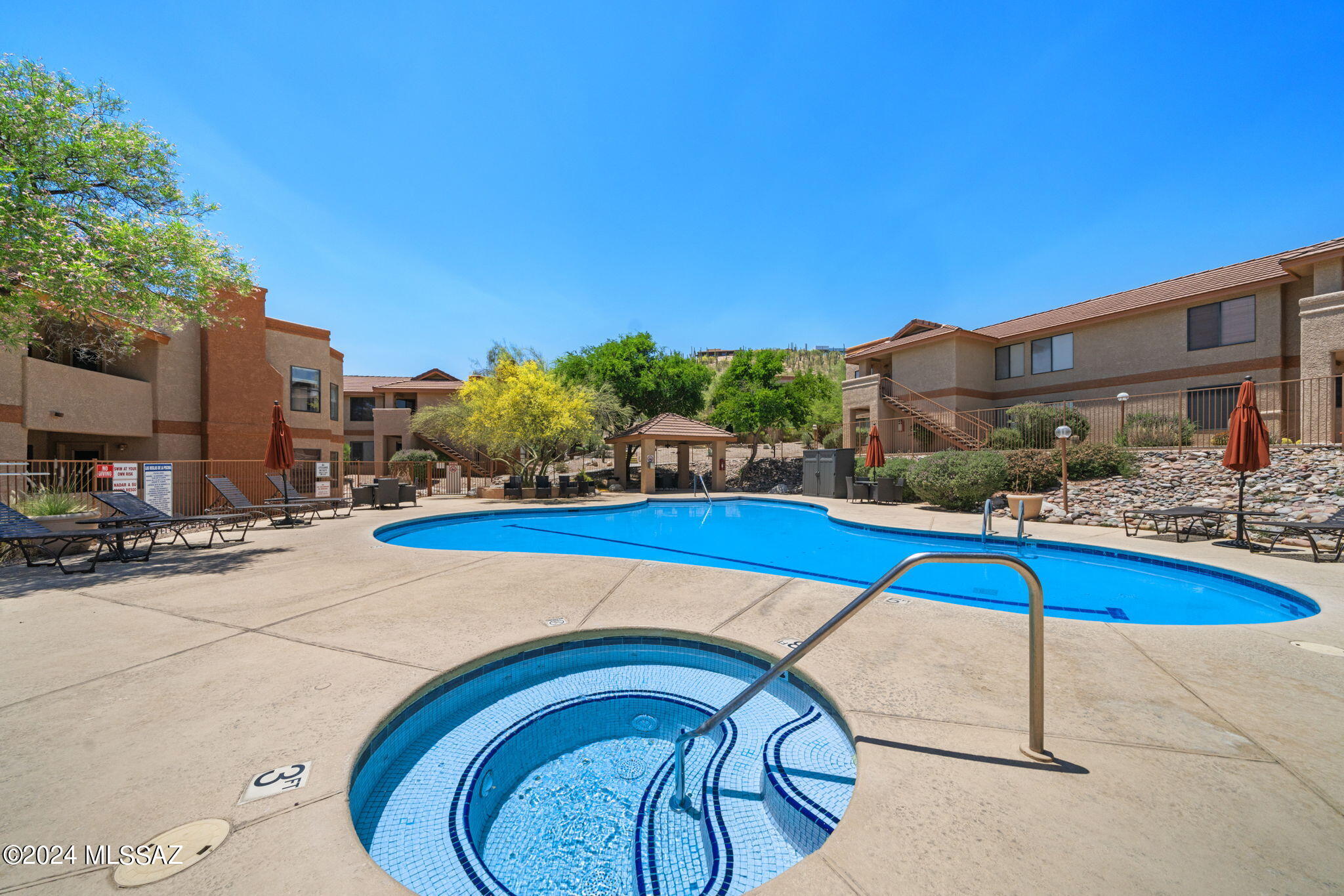7255 East Snyder Road, Unit 4206 Tucson, AZ 85750 - Photo 27 of 33 a view of swimming pool with outdoor seating and plants