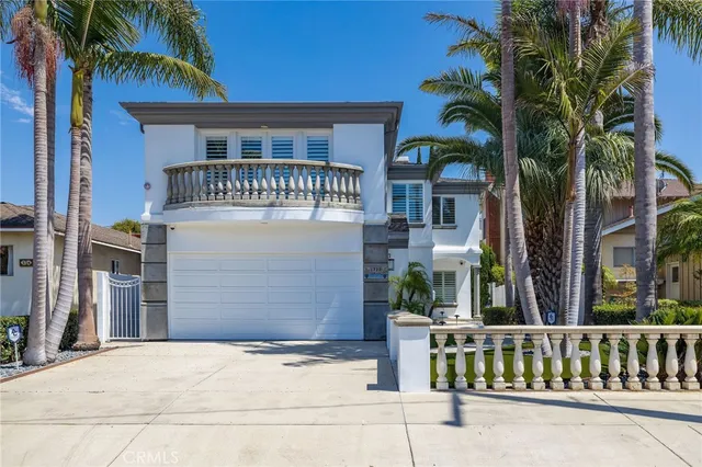 a front view of a house with tree s