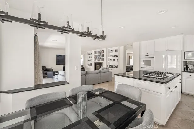 a kitchen with a stove a sink and a refrigerator