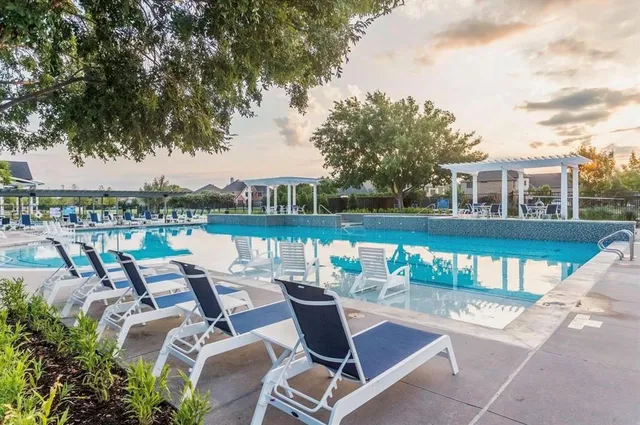 a view of a lake with couches and city view
