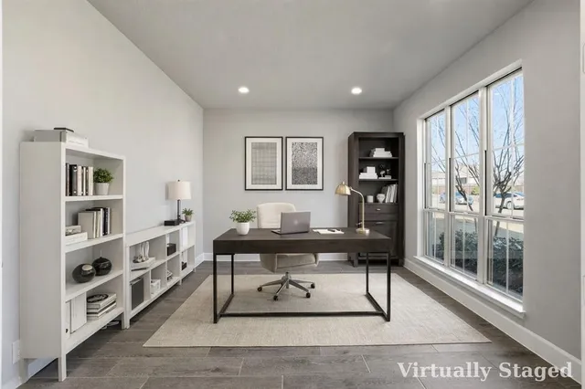 a view of a workspace with furniture