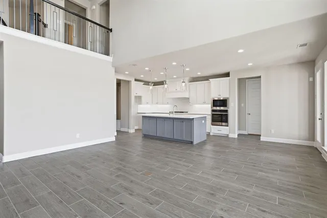 a view of kitchen with wooden floor