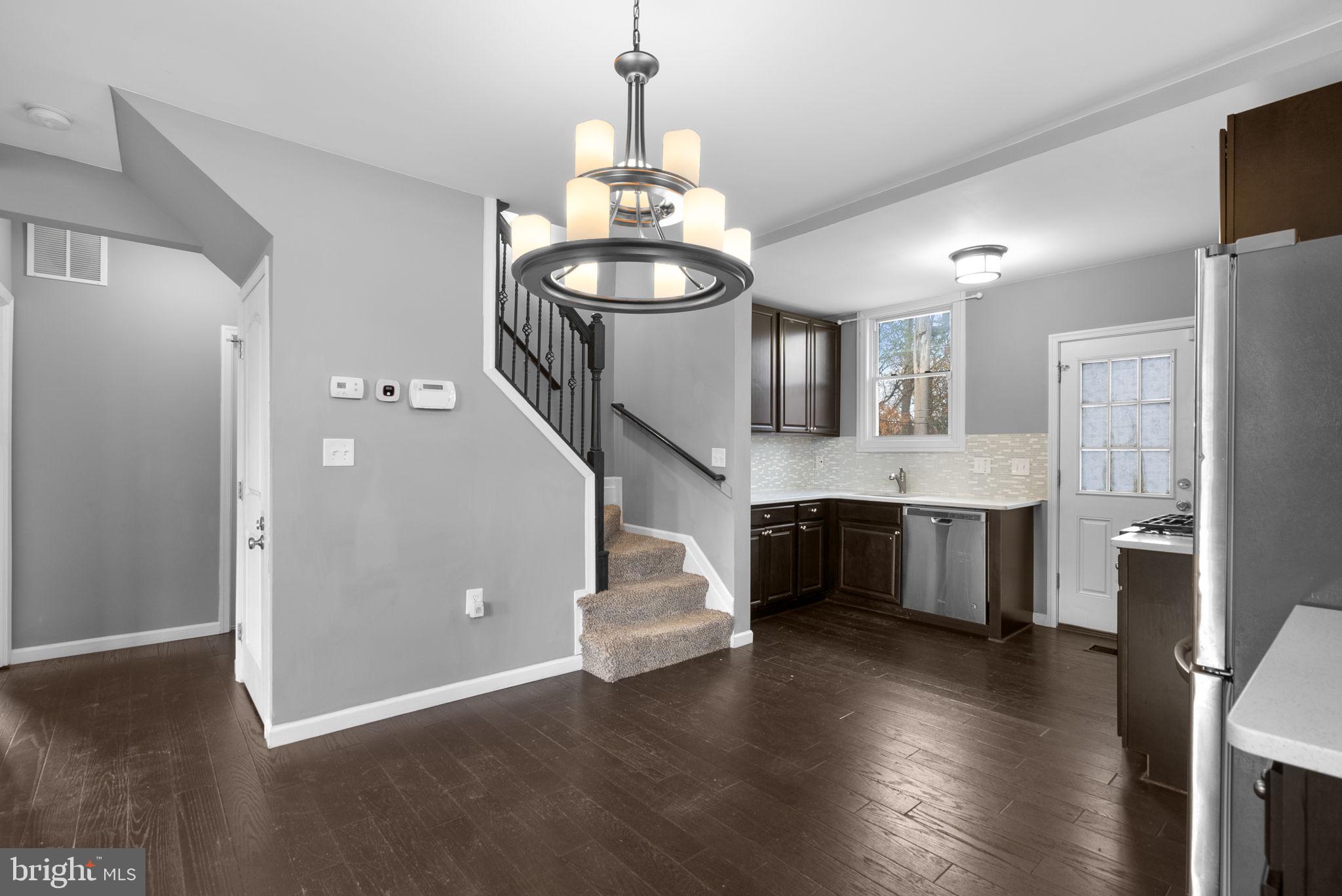 4308 Mainfield Avenue Baltimore, MD 21214 - Photo 11 of 41 a view of a kitchen with a refrigerator and microwave
