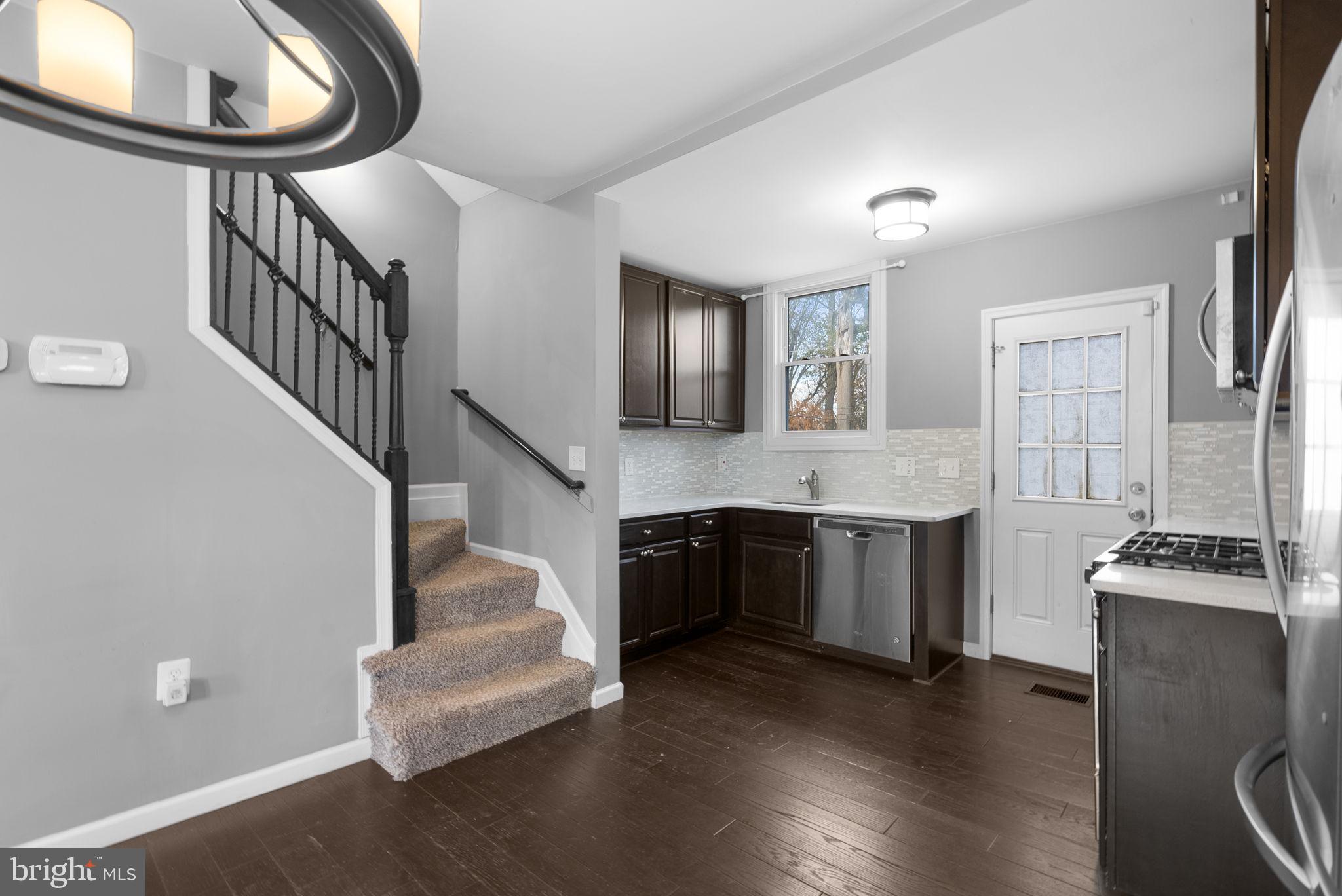 4308 Mainfield Avenue Baltimore, MD 21214 - Photo 15 of 41 a living room with furniture and a fireplace