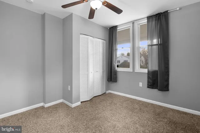 a view of workspace with window and ceiling fan