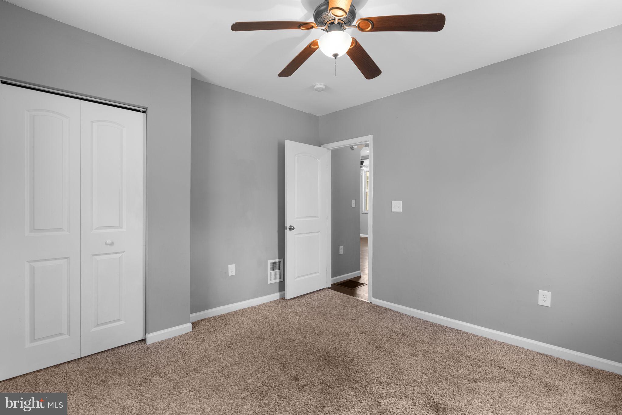 4308 Mainfield Avenue Baltimore, MD 21214 - Photo 24 of 41 an empty room with closet and a chandelier fan