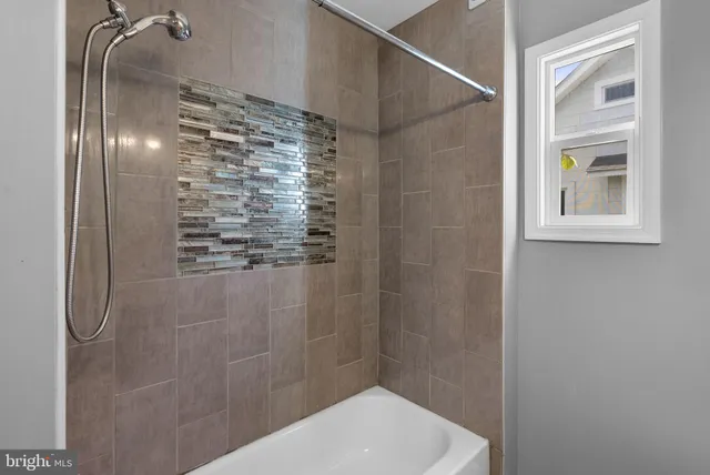 a bathroom with a sink vanity and a toilet