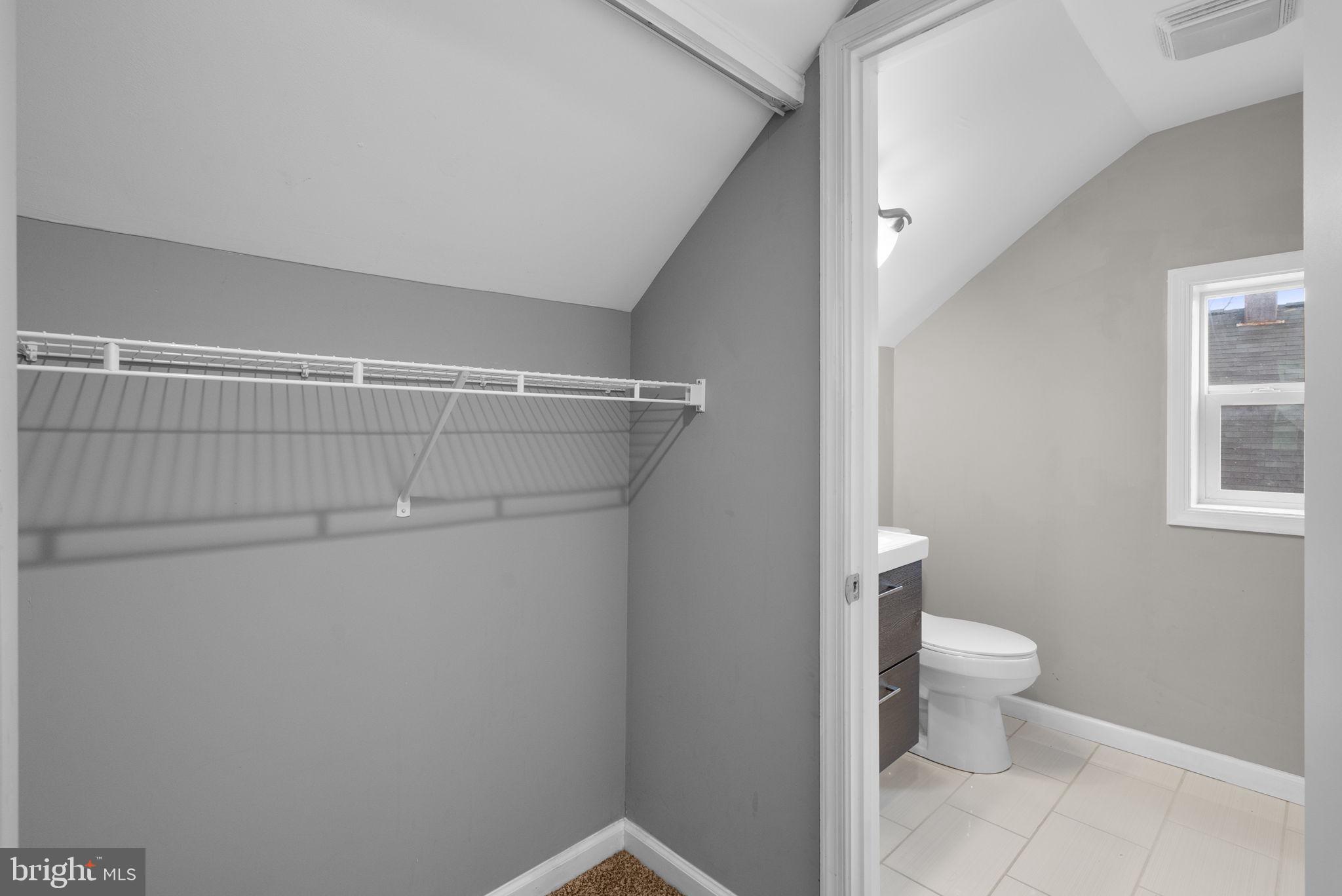 4308 Mainfield Avenue Baltimore, MD 21214 - Photo 30 of 41 a bathroom with a toilet and a shower