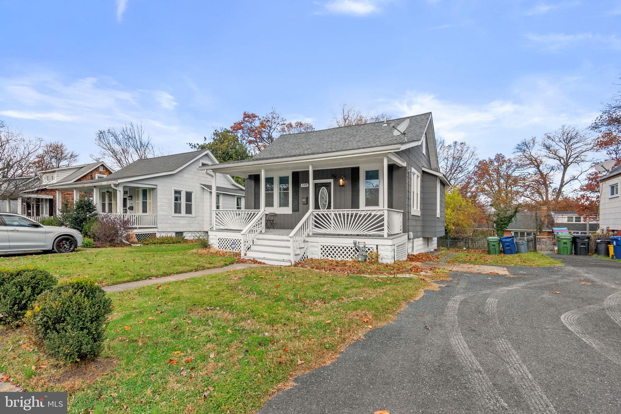 4308 Mainfield Avenue Baltimore, MD 21214 - Photo 3 of 41 a front view of a house with garden