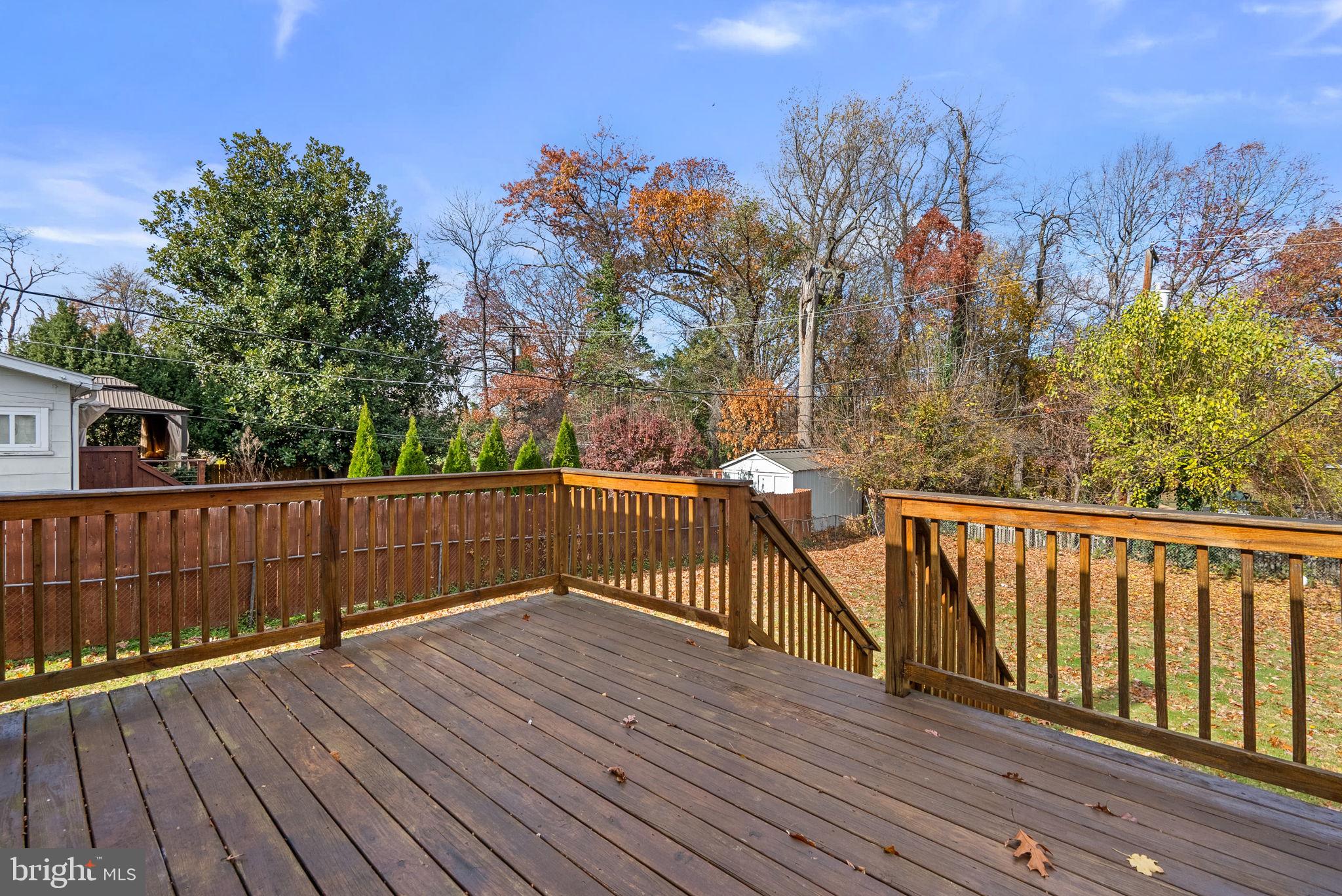4308 Mainfield Avenue Baltimore, MD 21214 - Photo 36 of 41 a view of a balcony with wooden fence