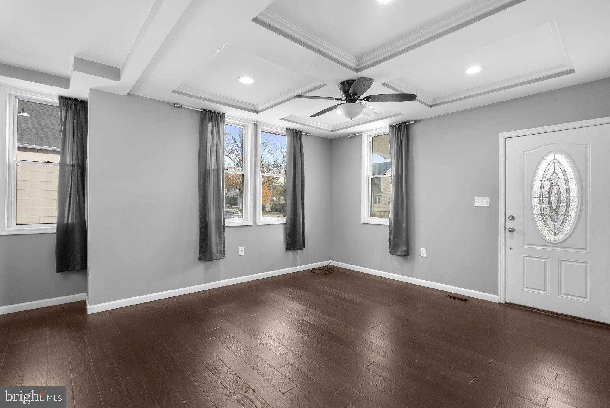 4308 Mainfield Avenue Baltimore, MD 21214 - Photo 9 of 41 a view of an empty room with wooden floor