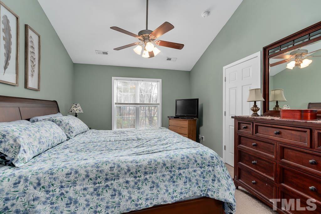 201 Tast Drive Wendell, NC 27591 - Photo 11 of 22 a bedroom with a bed and a flat screen tv