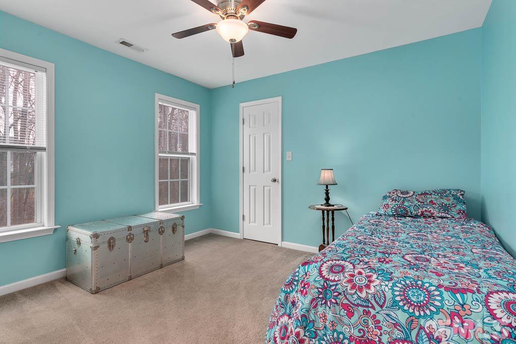 201 Tast Drive Wendell, NC 27591 - Photo 13 of 22 a bedroom with a bed and a window