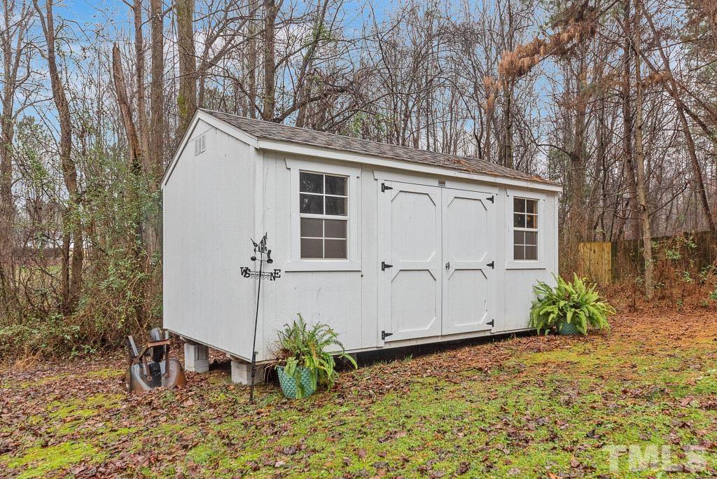 201 Tast Drive Wendell, NC 27591 - Photo 20 of 22 a view of a house with backyard and garden