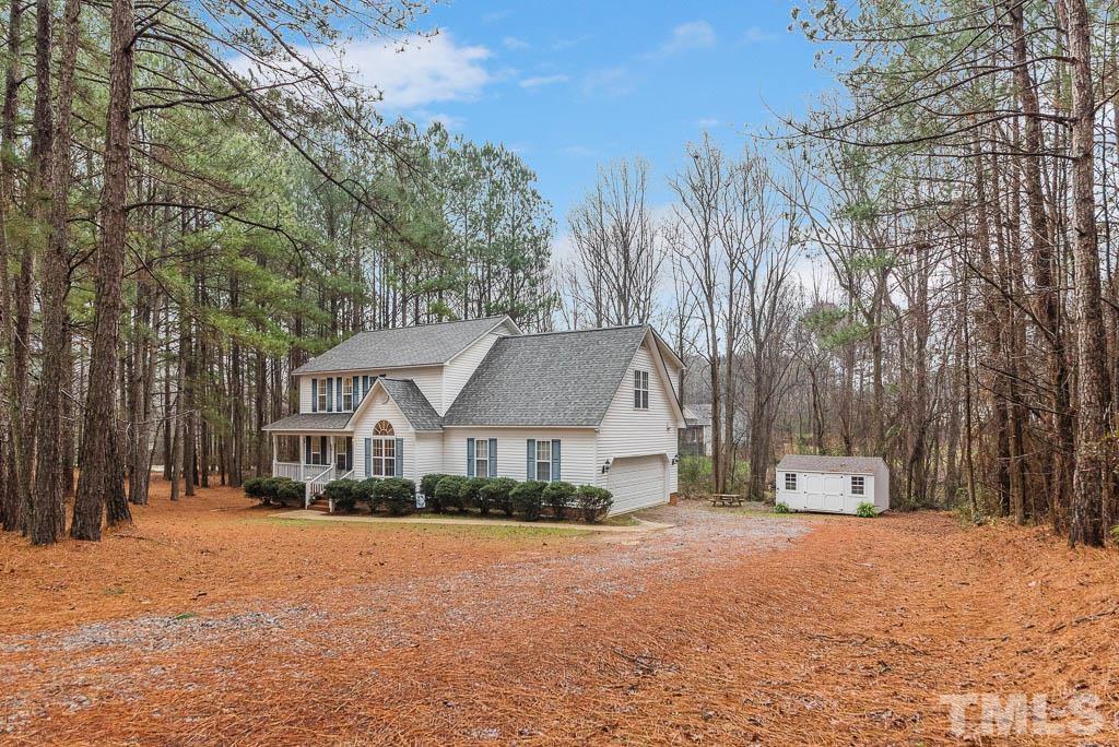 201 Tast Drive Wendell, NC 27591 - Photo 3 of 22 a front view of a house with a yard and covered with snow