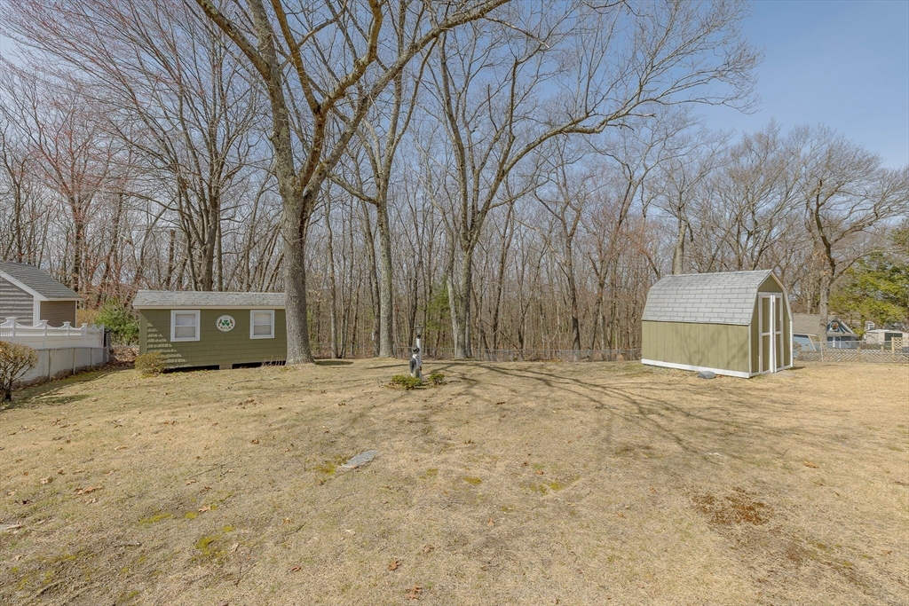 23 Fox Hill Road Billerica, MA 01821 - Photo 32 of 36 a house with trees in front of it