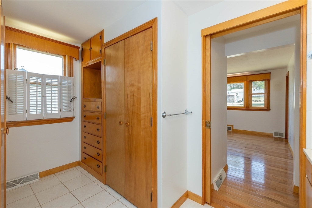 23 Fox Hill Road Billerica, MA 01821 - Photo 8 of 36 a view of an empty room with wooden floor and a window