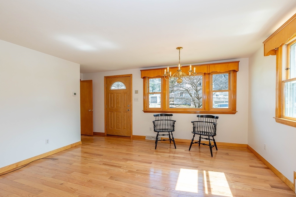 23 Fox Hill Road Billerica, MA 01821 - Photo 9 of 36 a view of a livingroom with wooden floor and furniture