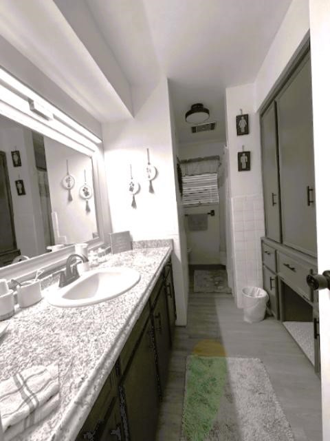 451 Pennington Street Lovelady, TX 75851 - Photo 12 of 28 a bathroom with a granite countertop sink a mirror and shower