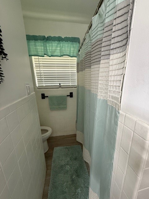 451 Pennington Street Lovelady, TX 75851 - Photo 13 of 28 a bathroom with a window and toilet