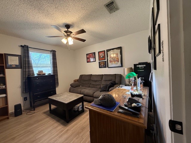 451 Pennington Street Lovelady, TX 75851 - Photo 14 of 28 a living room with furniture and a chandelier