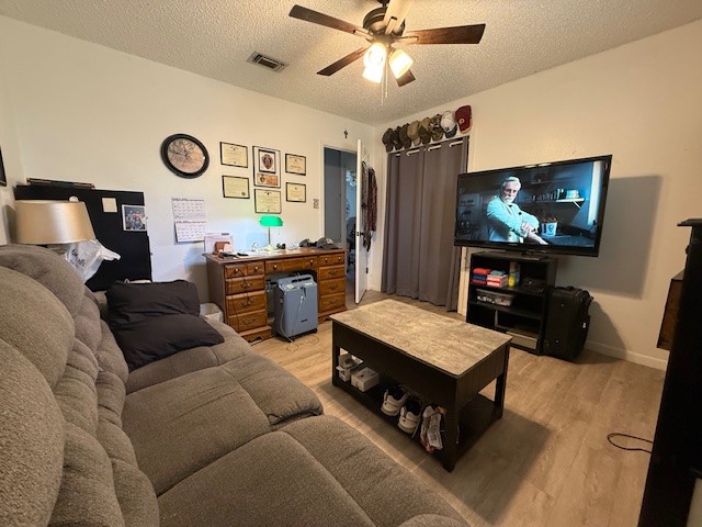 451 Pennington Street Lovelady, TX 75851 - Photo 15 of 28 a living room with furniture and a flat screen tv