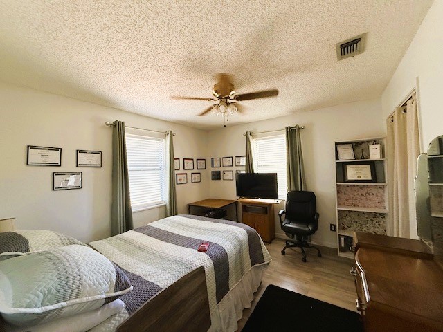 451 Pennington Street Lovelady, TX 75851 - Photo 16 of 28 a bedroom with a bed and a couch
