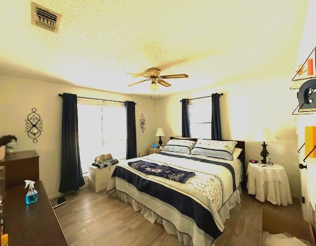 451 Pennington Street Lovelady, TX 75851 - Photo 17 of 28 a bedroom with a bed and a window