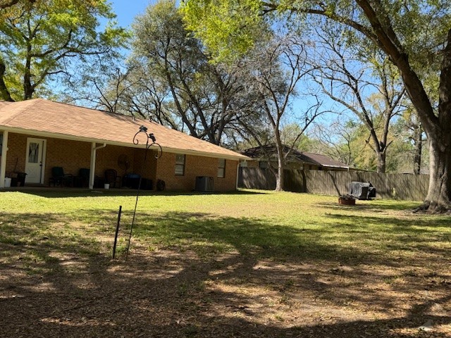 451 Pennington Street Lovelady, TX 75851 - Photo 20 of 28 a house that has a tree in front of it