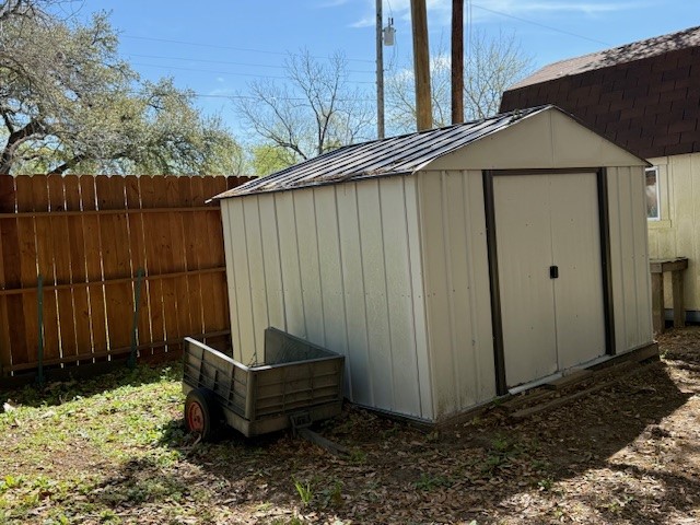 451 Pennington Street Lovelady, TX 75851 - Photo 27 of 28 a backyard of a house with yard fire pit and wooden fence