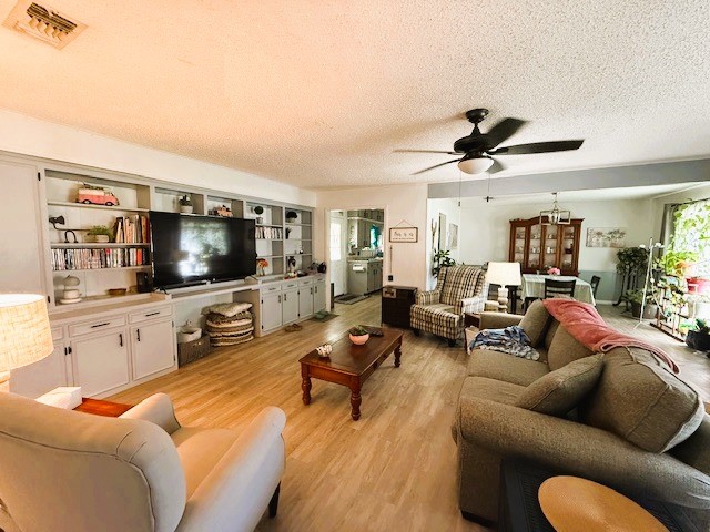 451 Pennington Street Lovelady, TX 75851 - Photo 5 of 28 a living room with furniture and a flat screen tv