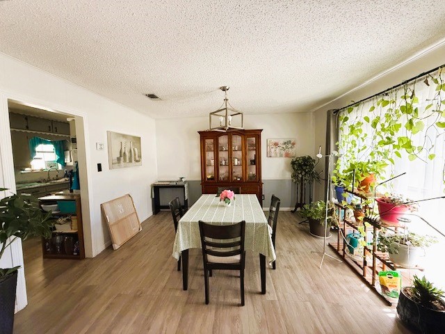 451 Pennington Street Lovelady, TX 75851 - Photo 7 of 28 a dining room with furniture and wooden floor