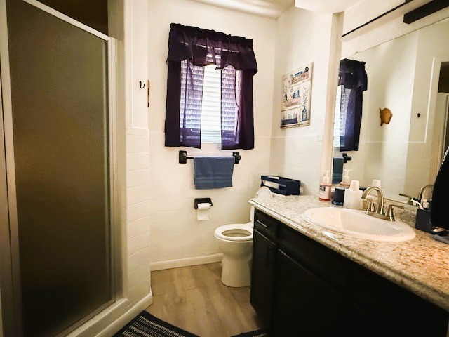 451 Pennington Street Lovelady, TX 75851 - Photo 10 of 28 a bathroom with a granite countertop sink toilet and shower