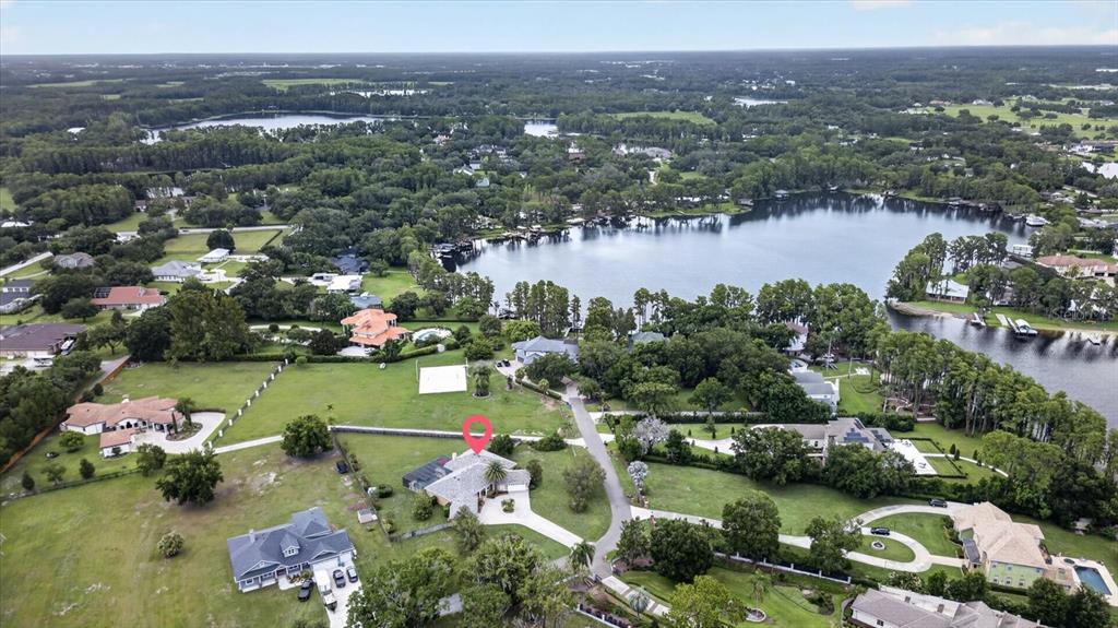 9427 Eddings Road Odessa, FL 33556 - Photo 87 of 93 an aerial view of lake residential houses with outdoor space and lake view