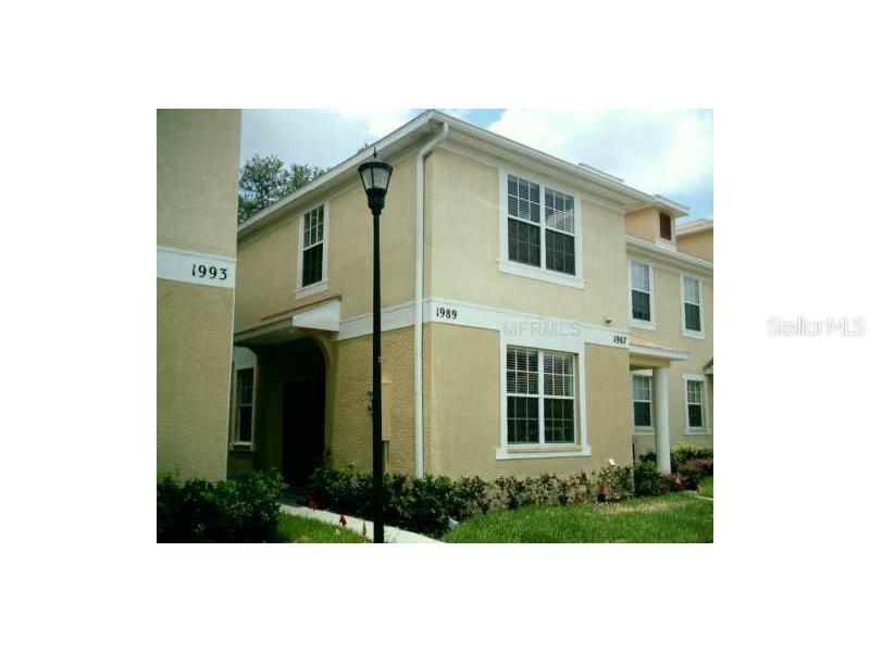 1989 Fiesta Ridge Court Tampa, FL 33604 - Photo 1 of 1 a front view of a house with a yard
