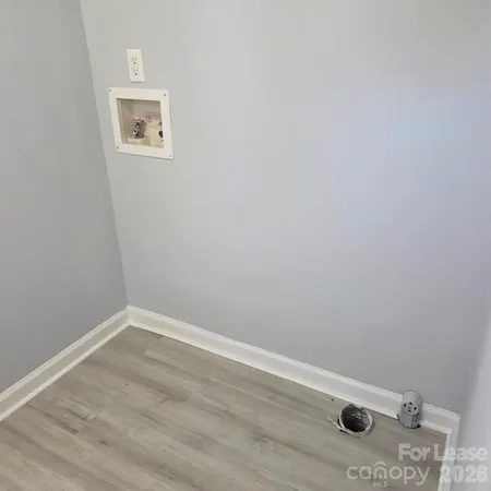 a view of a small space with empty racks on the wall