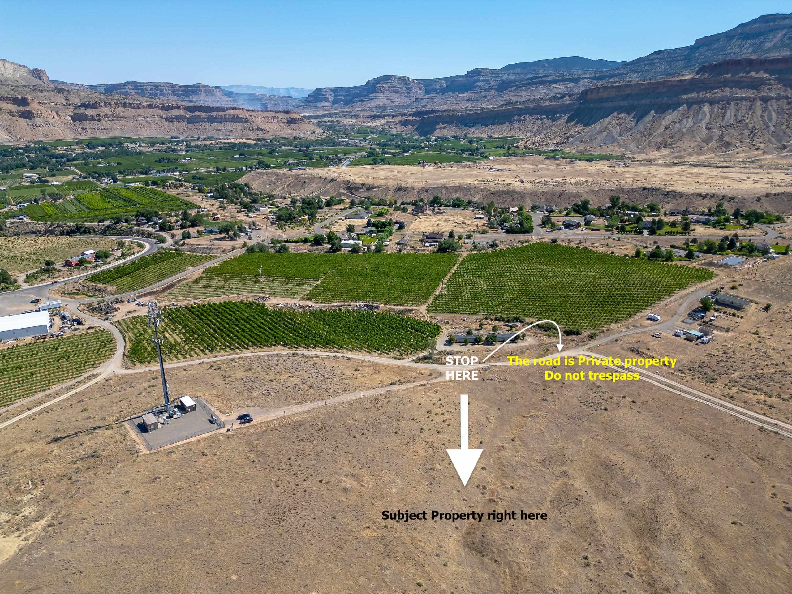 583 38 Road Palisade, CO 81526 - Photo 1 of 5 an aerial view of a houses with a yard and lake view