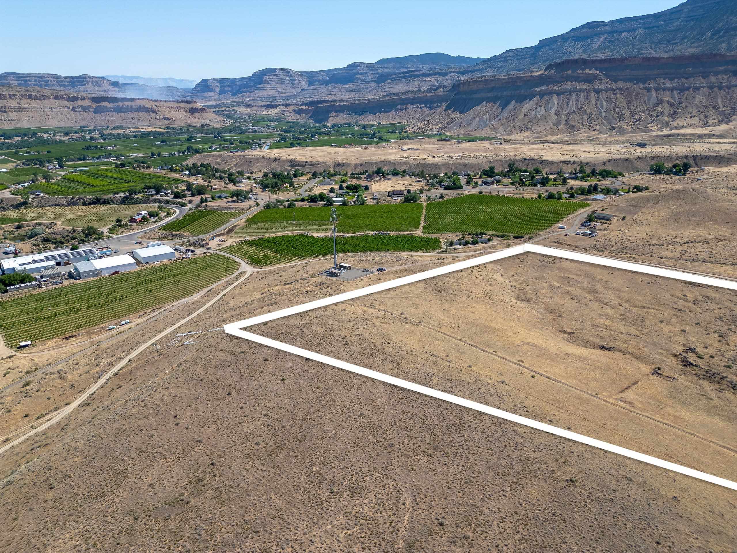 583 38 Road Palisade, CO 81526 - Photo 3 of 5 a view of a city with an ocean view