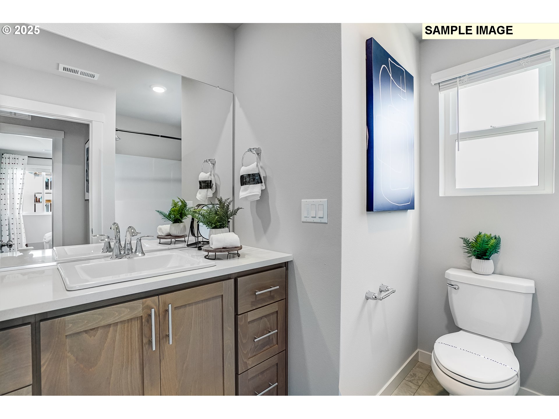 16656 Southwest Darling Lane, Unit HS21 Tigard, OR 97224 - Photo 18 of 31 a bathroom with a granite countertop toilet sink and mirror
