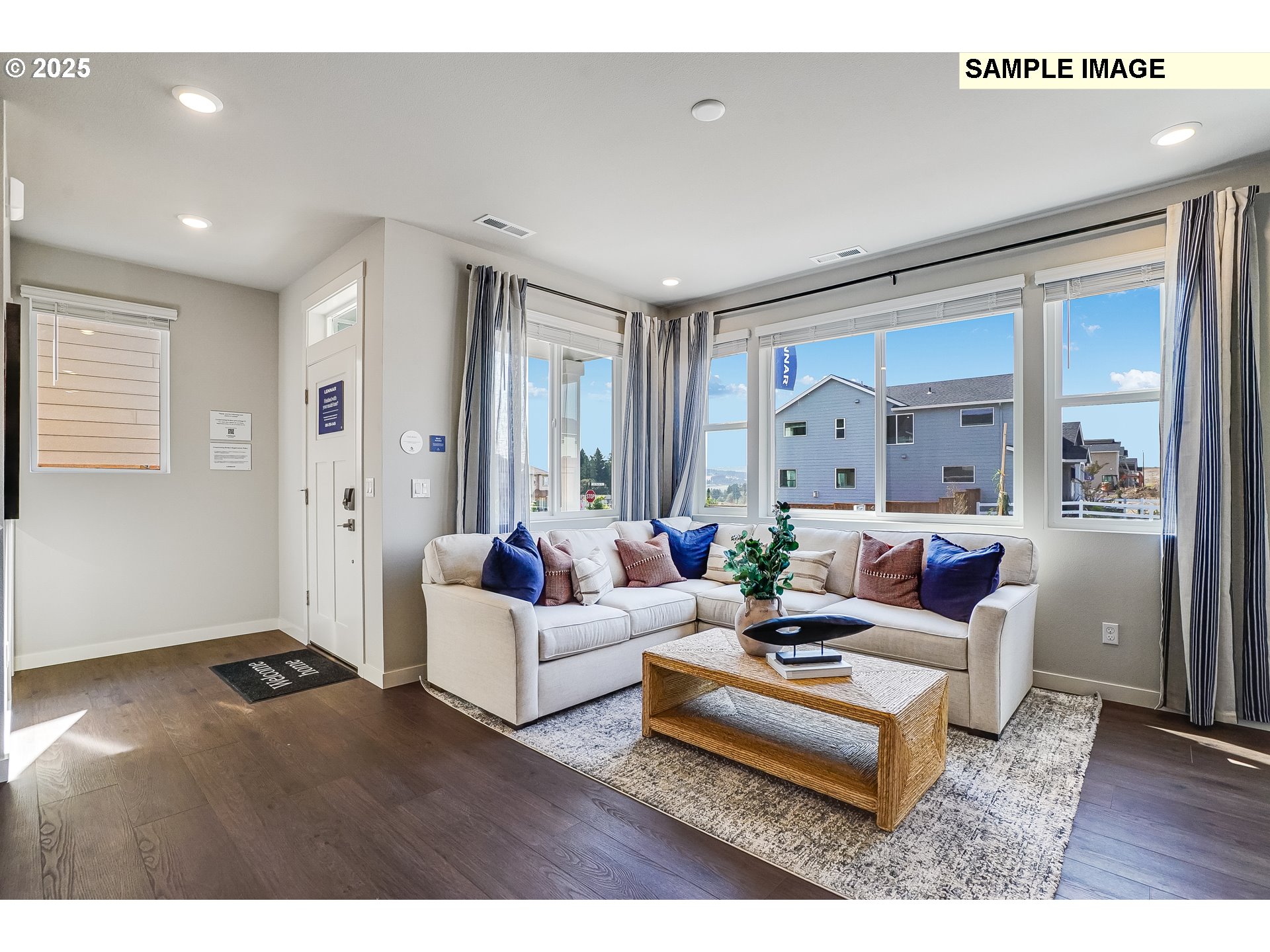 16656 Southwest Darling Lane, Unit HS21 Tigard, OR 97224 - Photo 2 of 31 a living room with furniture and wooden floor