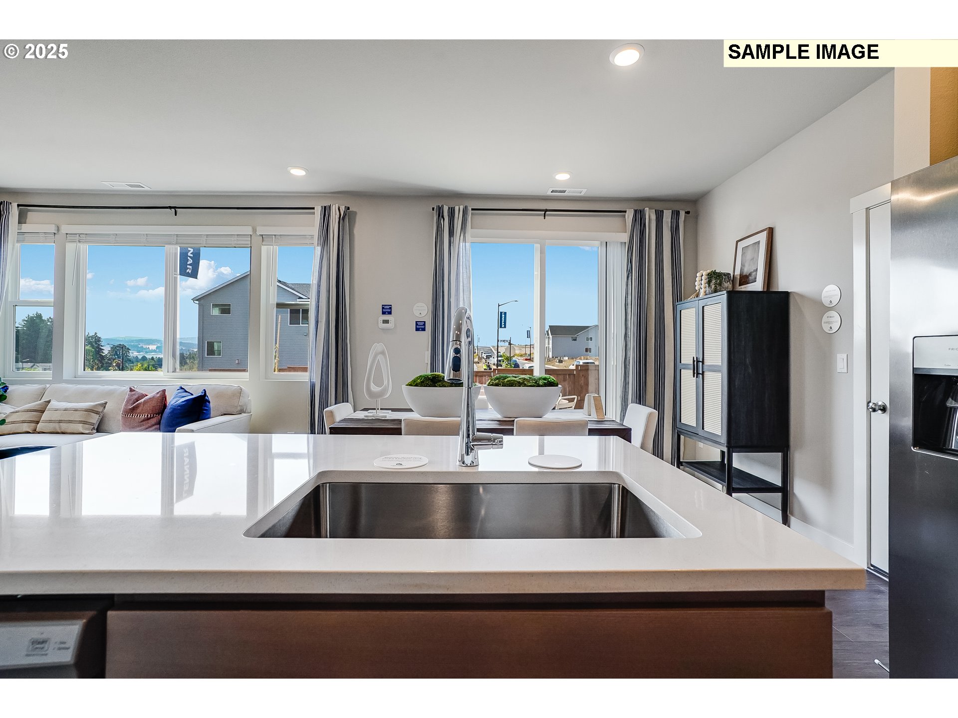 16656 Southwest Darling Lane, Unit HS21 Tigard, OR 97224 - Photo 8 of 31 a kitchen with a sink and a refrigerator