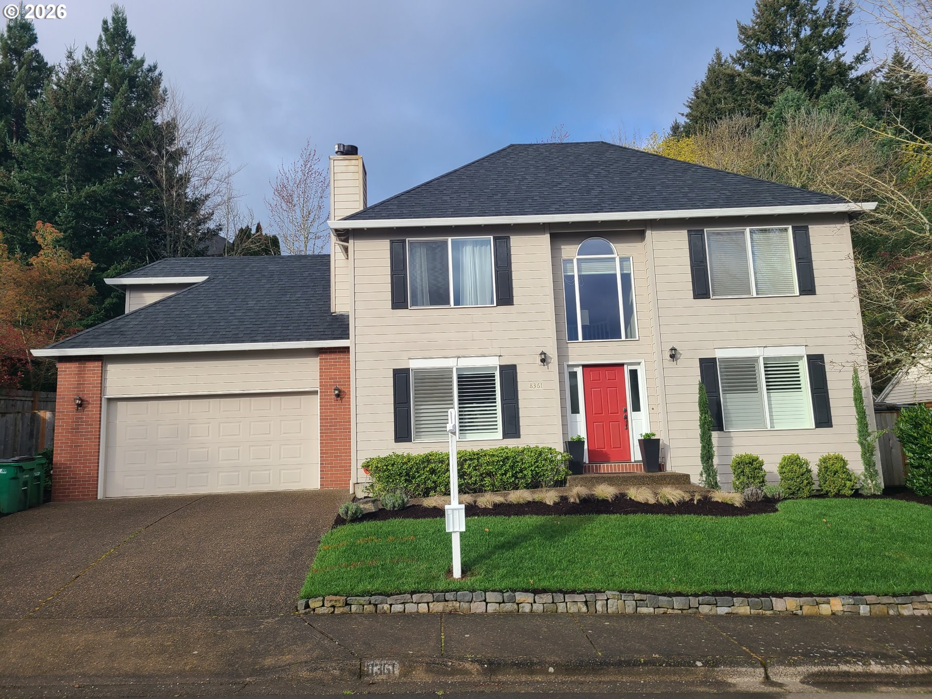 8361 Southwest 168th Avenue Beaverton, OR 97007 - Photo 1 of 31 a front view of a house with a yard and garage