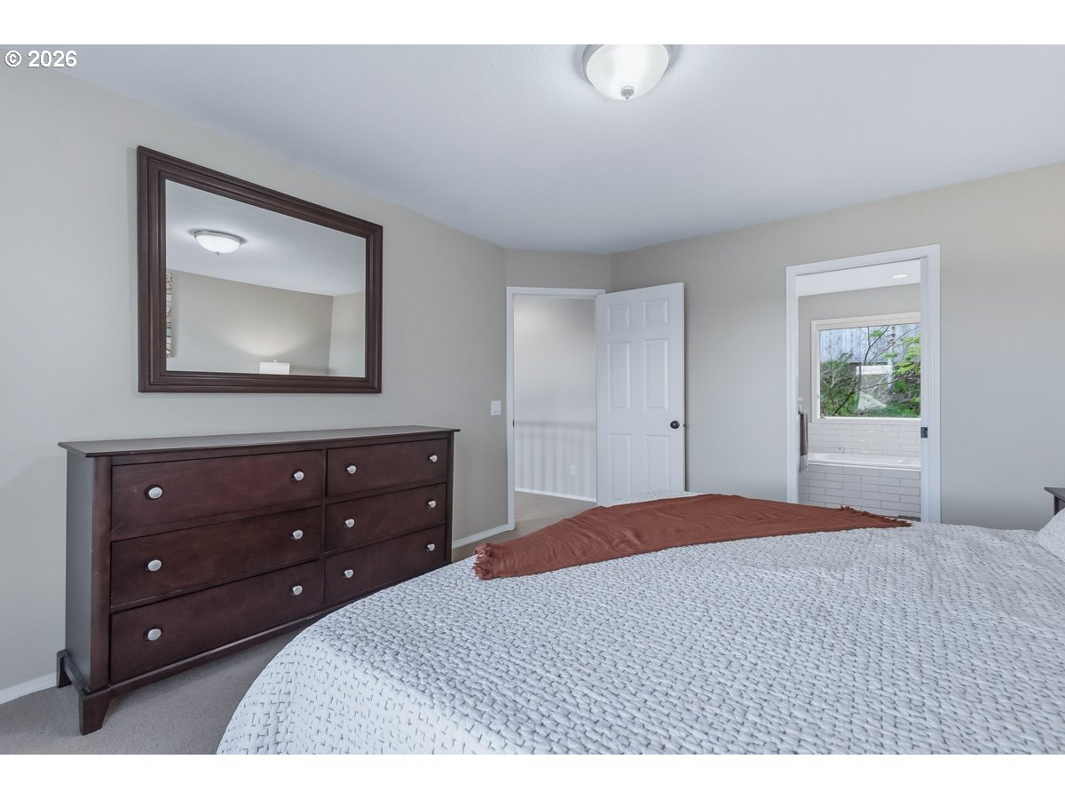 8361 Southwest 168th Avenue Beaverton, OR 97007 - Photo 21 of 31 a bedroom with a bed and a dresser