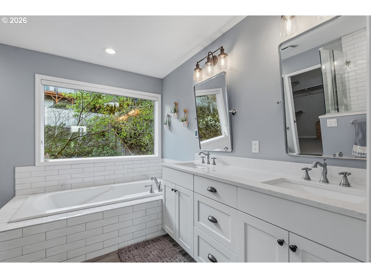 8361 Southwest 168th Avenue Beaverton, OR 97007 - Photo 22 of 31 a bathroom with a tub sink and mirror