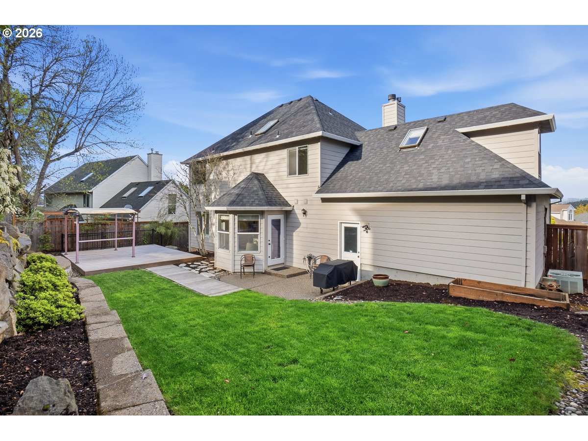 8361 Southwest 168th Avenue Beaverton, OR 97007 - Photo 27 of 31 a front view of a house with a garden and patio